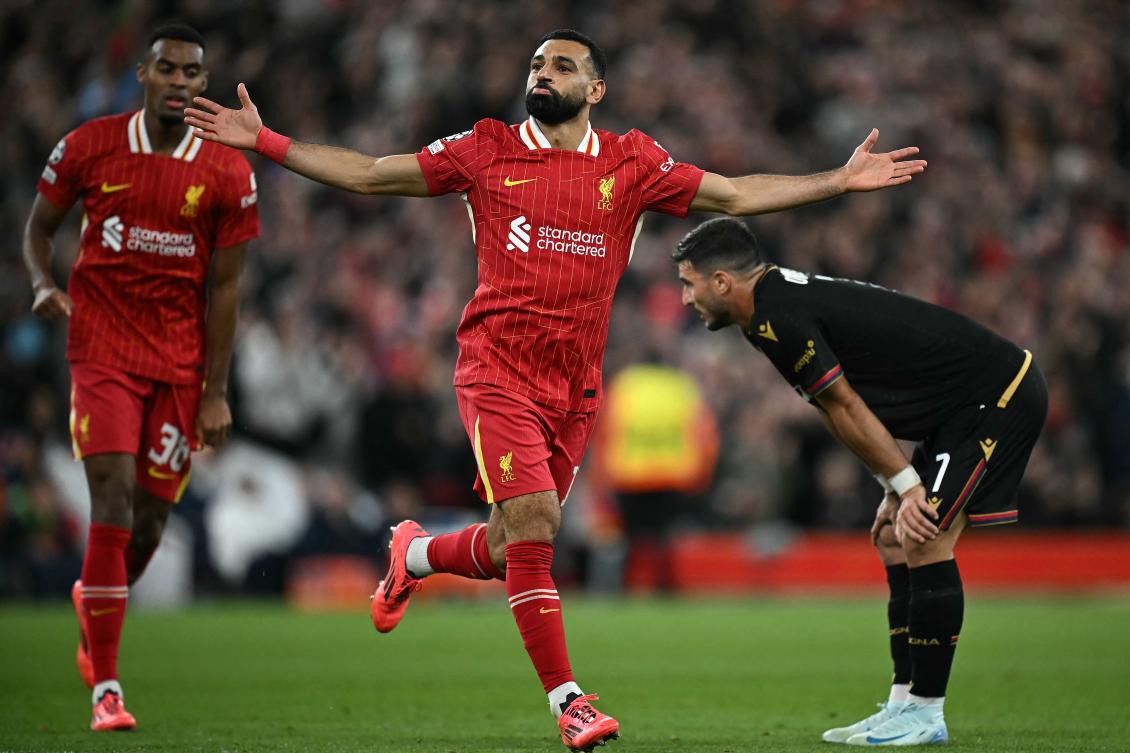 Liverpool’s Egyptian striker Mohamed Salah celebrates scoring the team’s second goal during their UEFA Champions League league stage match against Bologna at Anfield in Liverpool, on Oct. 2, 2024. (AFP)