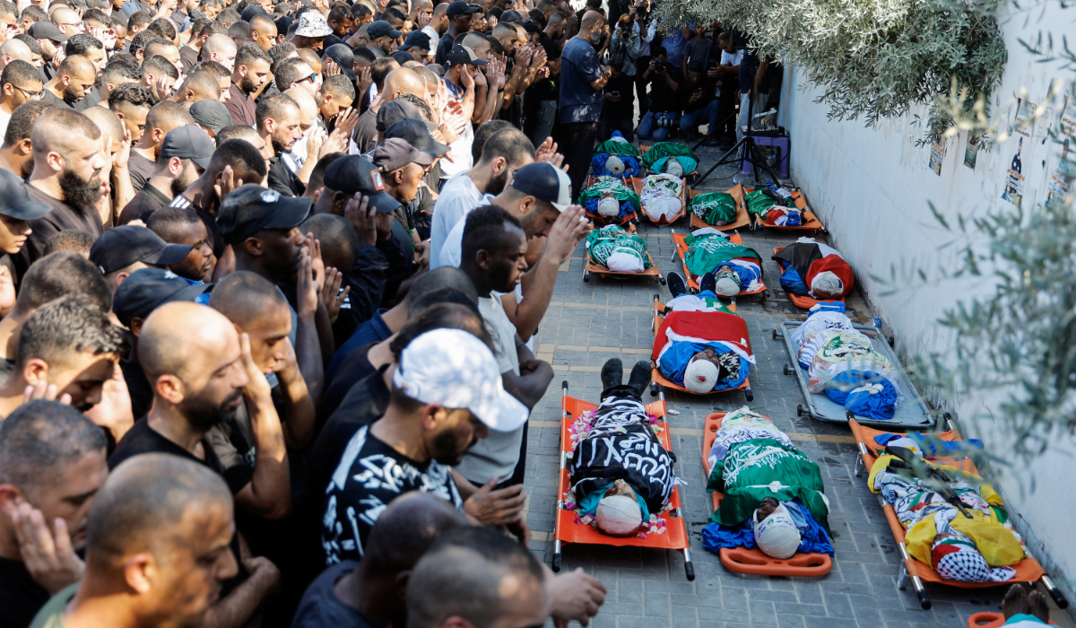 Mourners attend the funeral of Palestinians killed in an Israeli airstrike, in Tulkarm camp, in the Israeli-occupied West Bank, October 4, 2024. (REUTERS)