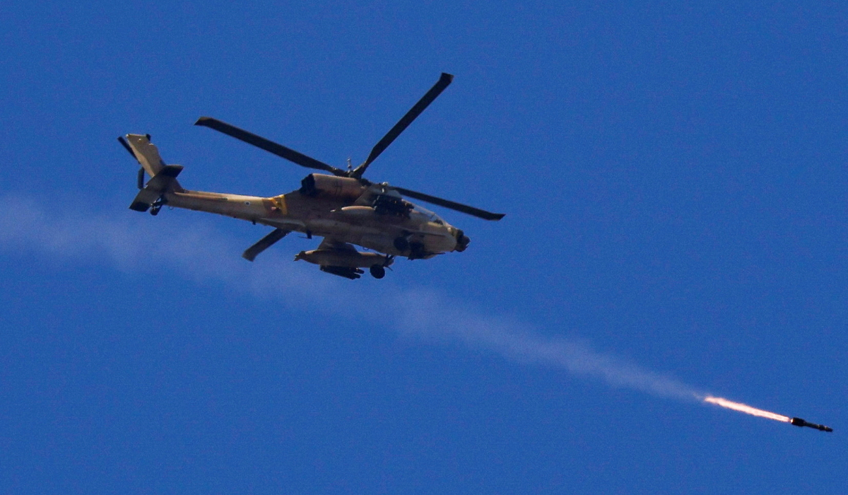 An Israeli Apache attack helicopter fires a missile towards southern Lebanon, amid hostilities between Hezbollah and Israel, as seen from northern Israel, October 4, 2024. (REUTERS)