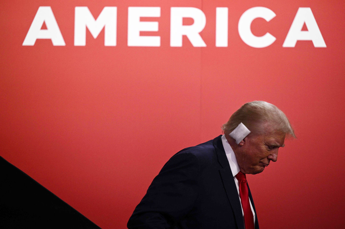 Republican presidential candidate Donald Trump is seen with a bandage on his ear after being wounded in an assassination attempt during the first day of the 2024 Republican National Convention at the Fiserv Forum in Milwaukee, Wisconsin, July 15, 2024. (AFP)