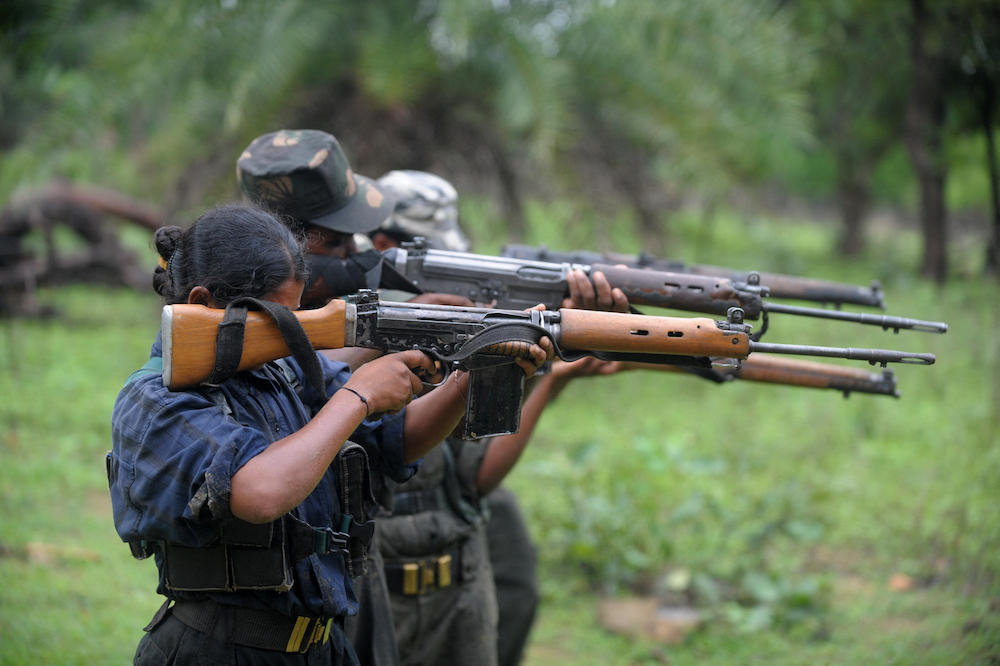 Above, Indian Maoists ready their weapons as they take part in a training camp in a forested area of Bijapur District in the central Indian state of Chhattisgarh on July 8, 2012. (AFP file photo)