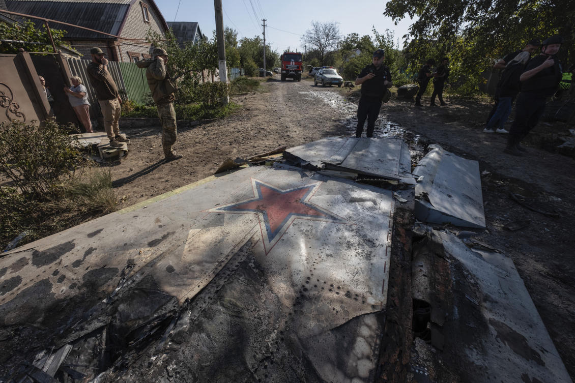 Ukrainian servicemen examine fragments of a Russian military plane that was shot down on the outskirts of Kostyantynivka, a near-front line city in the Donetsk region, on Oct. 5, 2024. (AP)