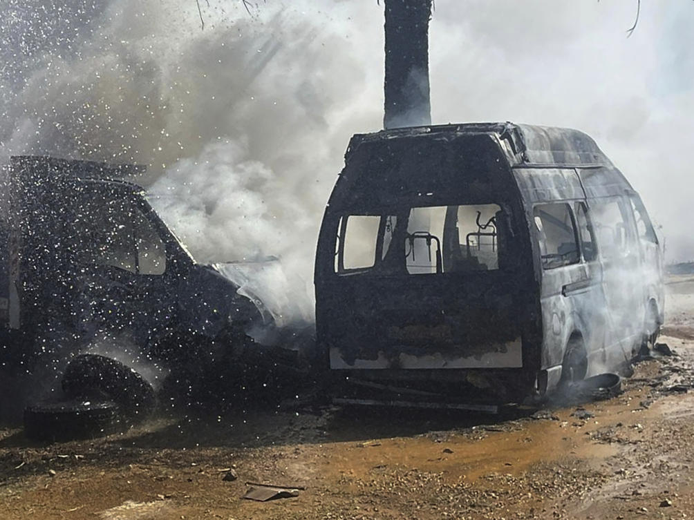 A truck and ambulance burn after Israeli airstrikes hit a group of paramedics outside a hospital in Marjayoun, south Lebanon, on Oct. 4, 2024. (AP)