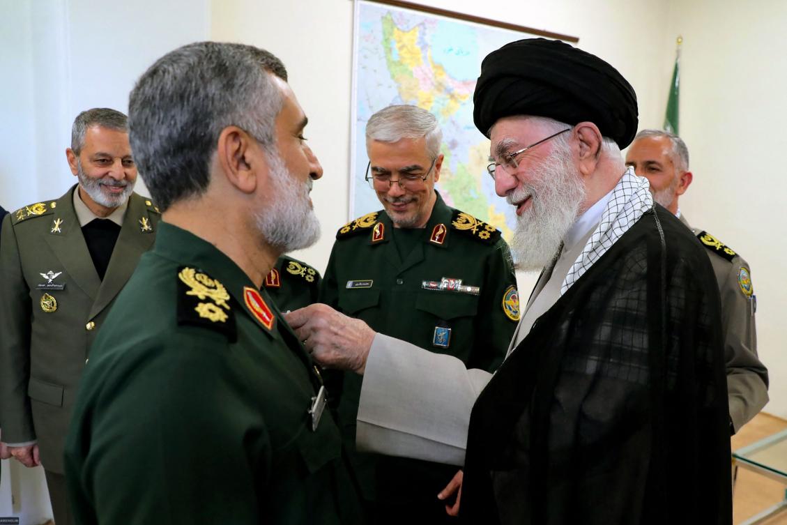 Iran's Supreme Leader Ayatollah Ali Khamenei (R) decorating the Islamic Revolutionary Guard Corps' Aerospace Force Commander Brigadier General Amir Ali Hajizadeh (L) with the 'Fath' badge in Tehran for planning the Iranian attack on Israel. (AFP)