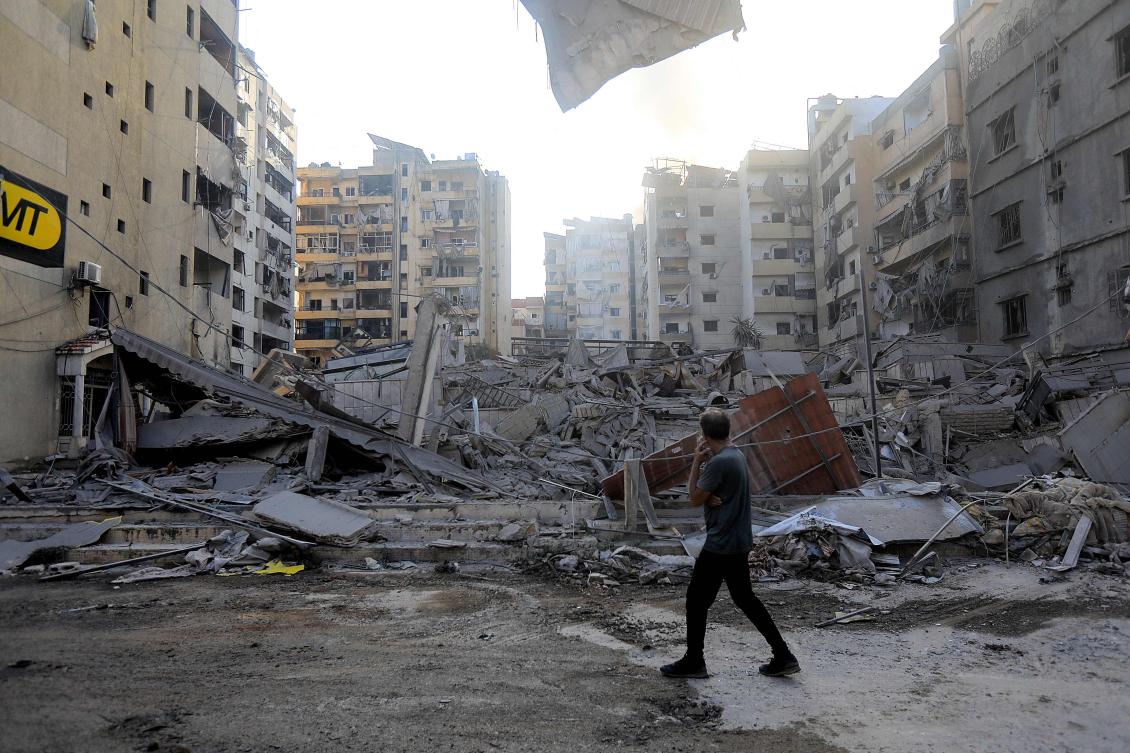 A man stares at the devastation in the aftermath of an Israeli strike that targeted the Sfeir neighbourhood in Beirut’s southern suburbs on October 6, 2024. (AFP)