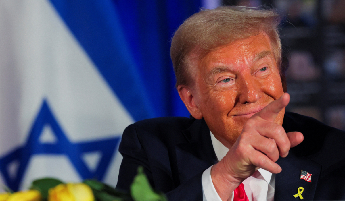 Republican presidential nominee and former U.S. President Donald Trump gestures as he participates in an event commemorating the one-year anniversary of the October 7 Hamas attacks on Israel, at his golf resort in Doral, Florida, U.S., October 7, 2024. (REUTERS)
