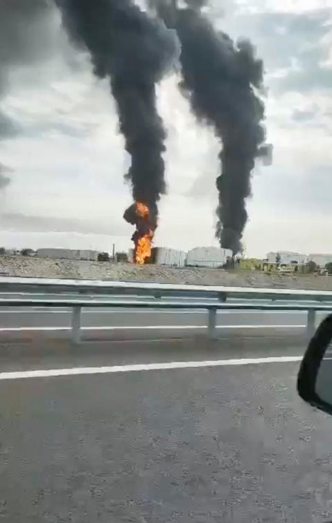 Footage taken from a moving vehicle shows a fire at an oil depot in Feodosia, Crimea, on the day the Ukrainian military said the energy facility was targeted during Russia's ongoing invasion of Ukraine, October 7, 2024. (Reuters)
