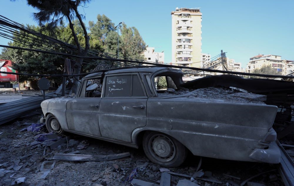 A vehicle lies damaged, in the aftermath of Israeli strikes on Beirut’s southern suburbs, amid the ongoing hostilities between Hezbollah and Israeli forces, in Lebanon, Oct. 8, 2024. (Reuters)