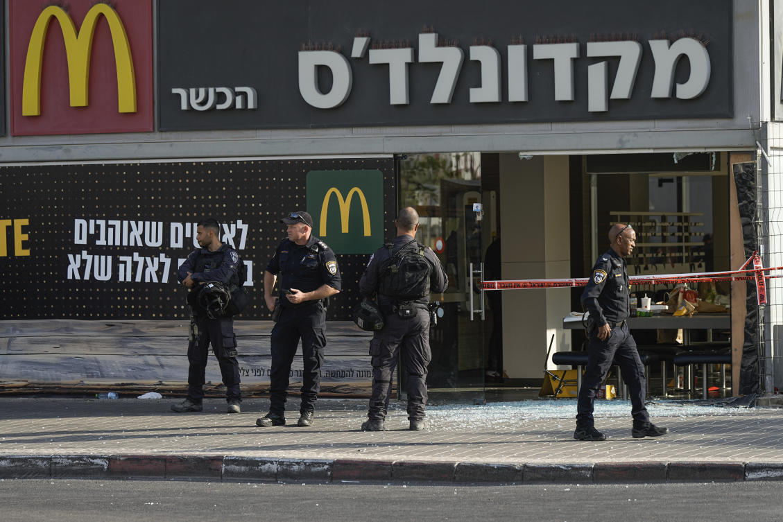 Police officers examine the scene of a stabbing and shooting attack earlier in Beersheba, Israel. (File/AP)