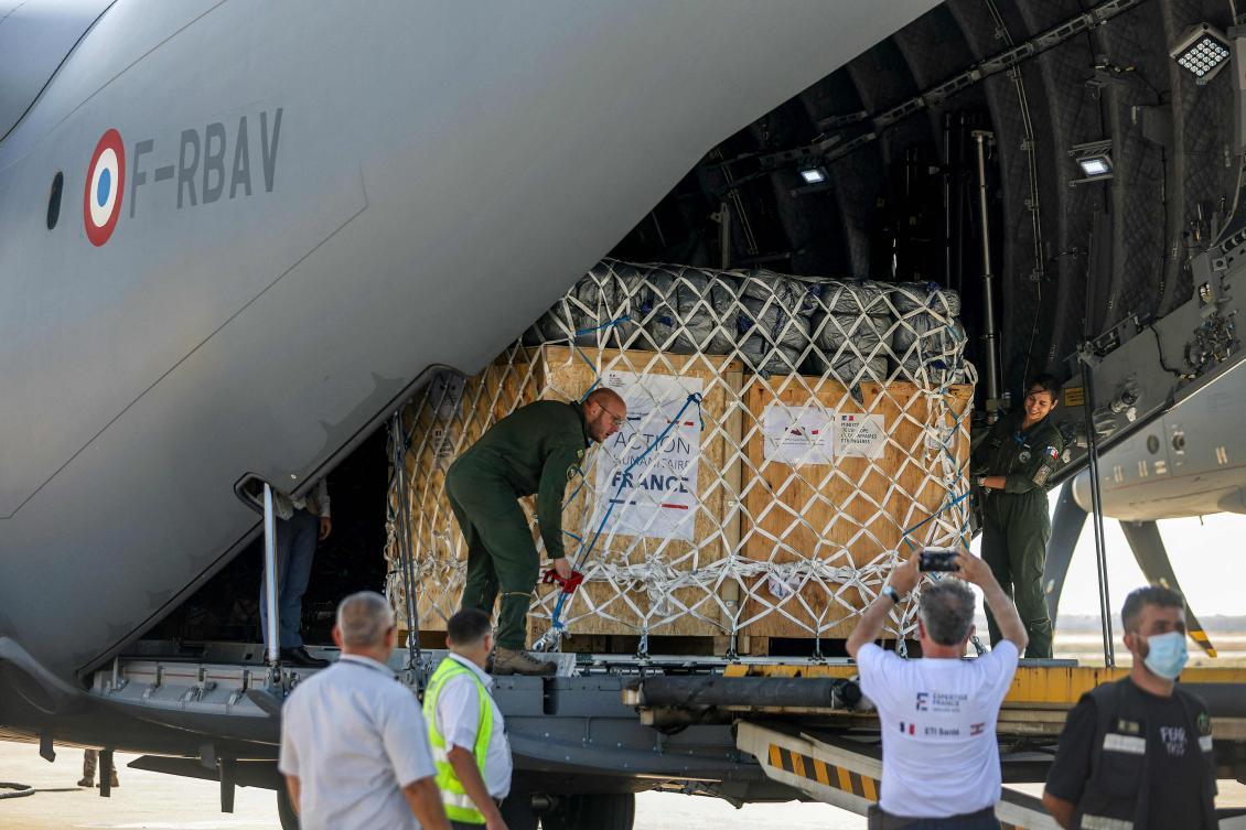 Medical aid provided by France is unloaded off of a French Air Force military transport aircraft on the tarmac at Beirut International Airport. (File/AFP)