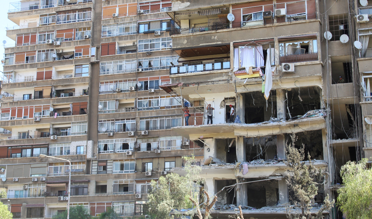 A view shows a damaged building in the aftermath of what Syrian state media reported was an Israeli strike in the Mezzah suburb, west of the Syrian capital Damascus, October 9, 2024. (Reuters/File)
