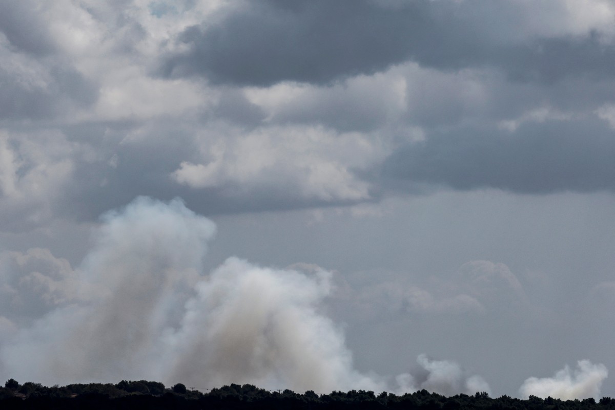 File Photo of smoke billows over hills in the Israeli-annexed Golan Heights after rockets were fired from southern Lebanon on September 20, 2024. (AFP)