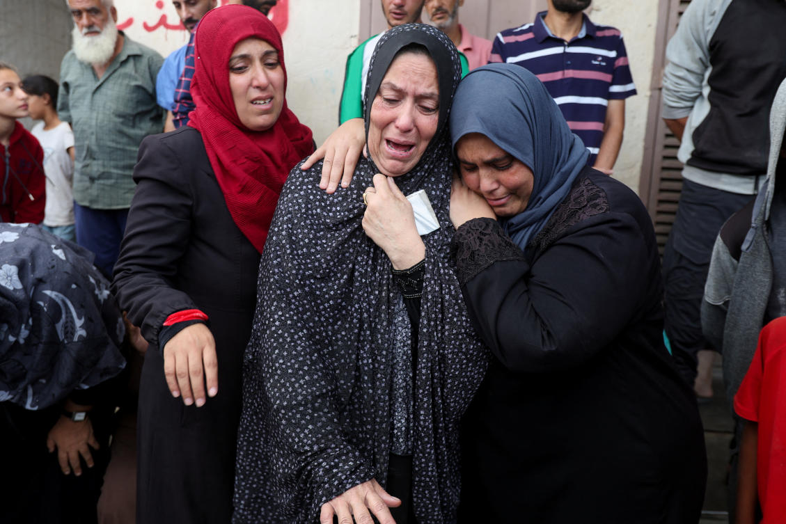 Mourners react next to the bodies of Palestinians who were killed in Israeli strikes, at Al-Aqsa Martyrs Hospital in Deir Al-Balah, central Gaza Strip on Oct. 8, 2024. (Reuters)