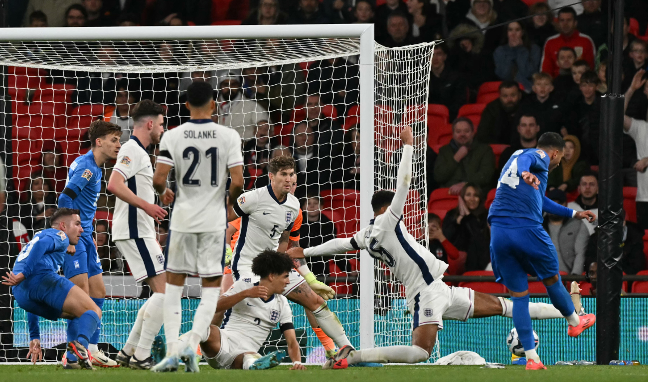 Greece's striker #14 Vangelis Pavlidis (R) shoots to score their second goal during the UEFA Nations League, League B - Group 2, football match between England and Greece at Wembley Stadium in London on October 10, 2024. (AFP)