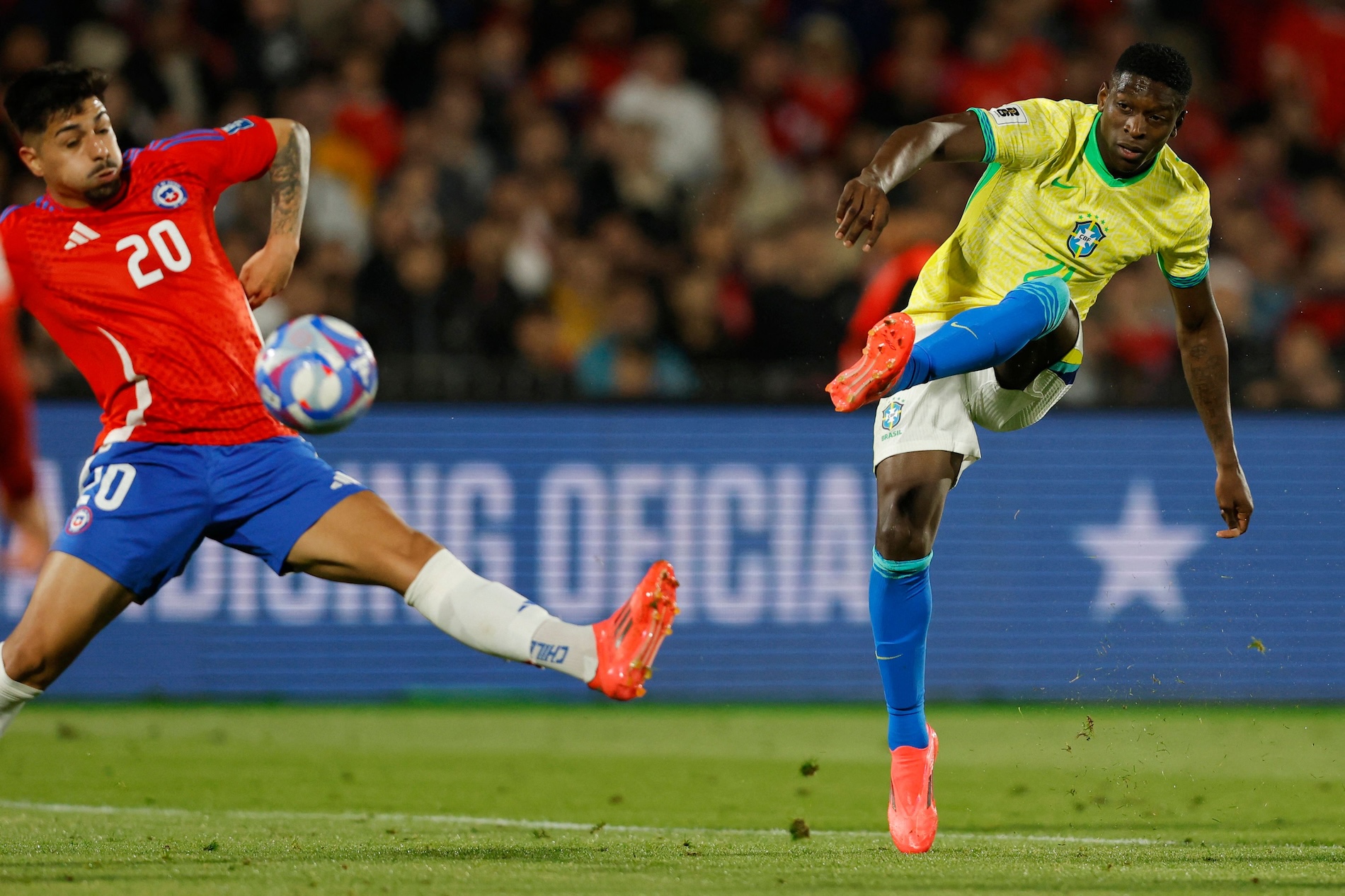 Brazil's forward Luiz Henrique (R) shoots and scores his team's second goal during the 2026 FIFA World Cup South American qualifying football match between Chile and Brazil, at the National stadium in Santiago, on Thursday. (AFP)