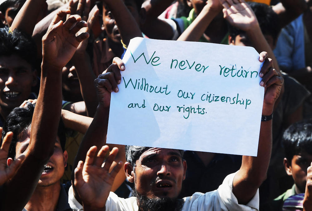 Above, a Rohingya refugee protests against a disputed repatriation program of stateless Muslims to Myanmar at the Unchiprang refugee camp near Teknaf on Nov. 15, 2018. (AFP file photo)