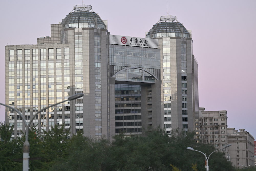 The central bank wants to promote interconnectivity in global financial infrastructure and the new trial aims to find solutions to issues that arise in cross-border settlements. (AFP)