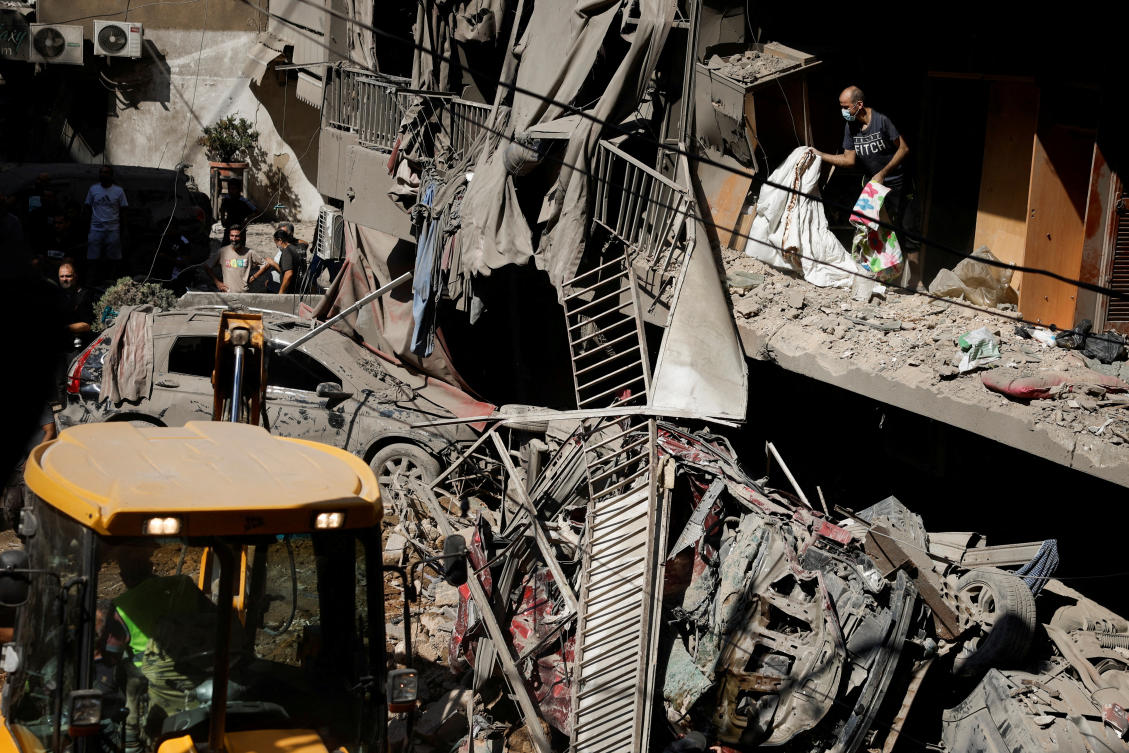 People inspect the site of an Israeli air strike, amid ongoing hostilities between Hezbollah and Israeli forces, in Beirut, Lebanon on Oct. 11, 2024. (Reuters)