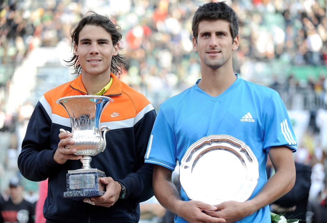 Rafael Nadal of Spain (L) and Novak Djokovic of Serbia pose with their trophies after their final match of the ATP Tennis Open match in Rome on May 3, 2009. (AFP)