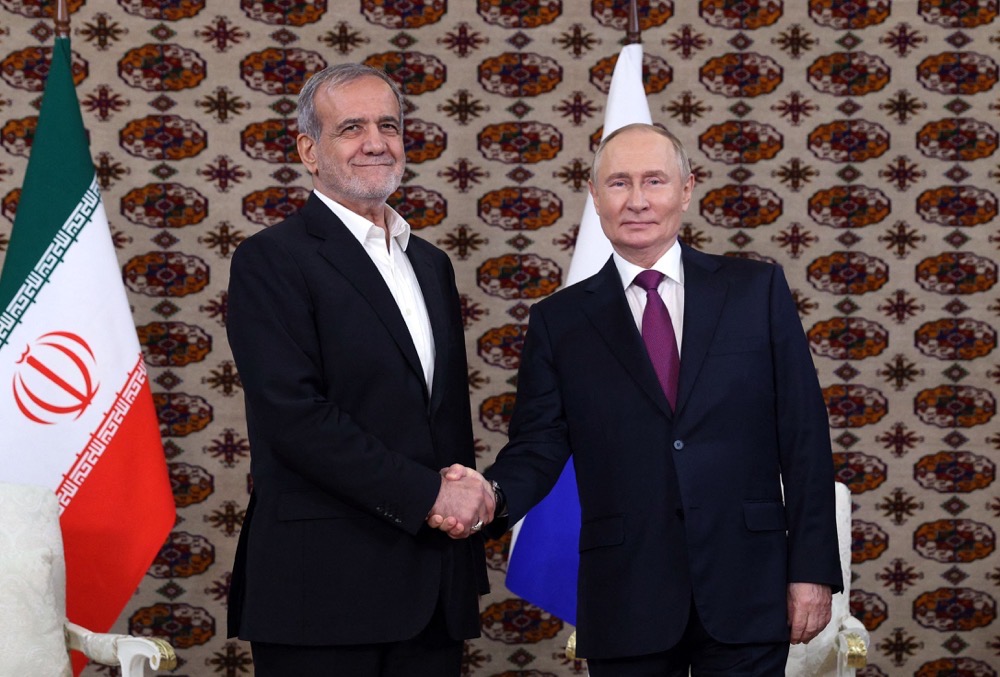 Russia's President Vladimir Putin meets with Iran’s President Masoud Pezeshkian. (AFP)