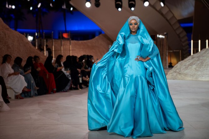 Supermodel Halima Aden walking the runway at the first edition of the Riyadh Fashion Week for Saudi designer Honayda Serafi. (AN/Huda Bashatah)