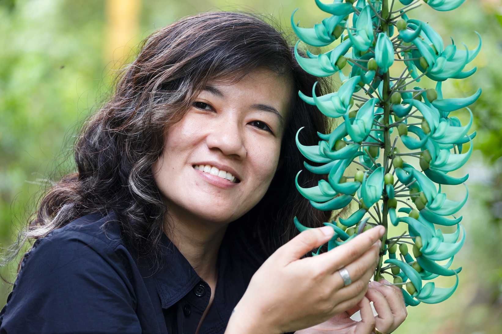 Celine Murillo holds jade vine in San Roque, Bulusan, Sorsogon province of the Philippines, February 2024. (Celine Murillo)