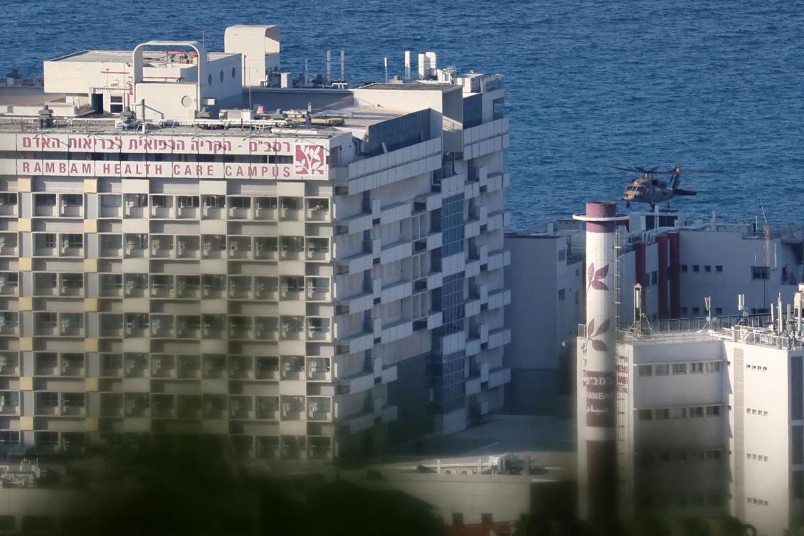 An Israeli military helicopter approaches Haifa’s Rambam hospital before landing there on October 11, 2024. (AFP)