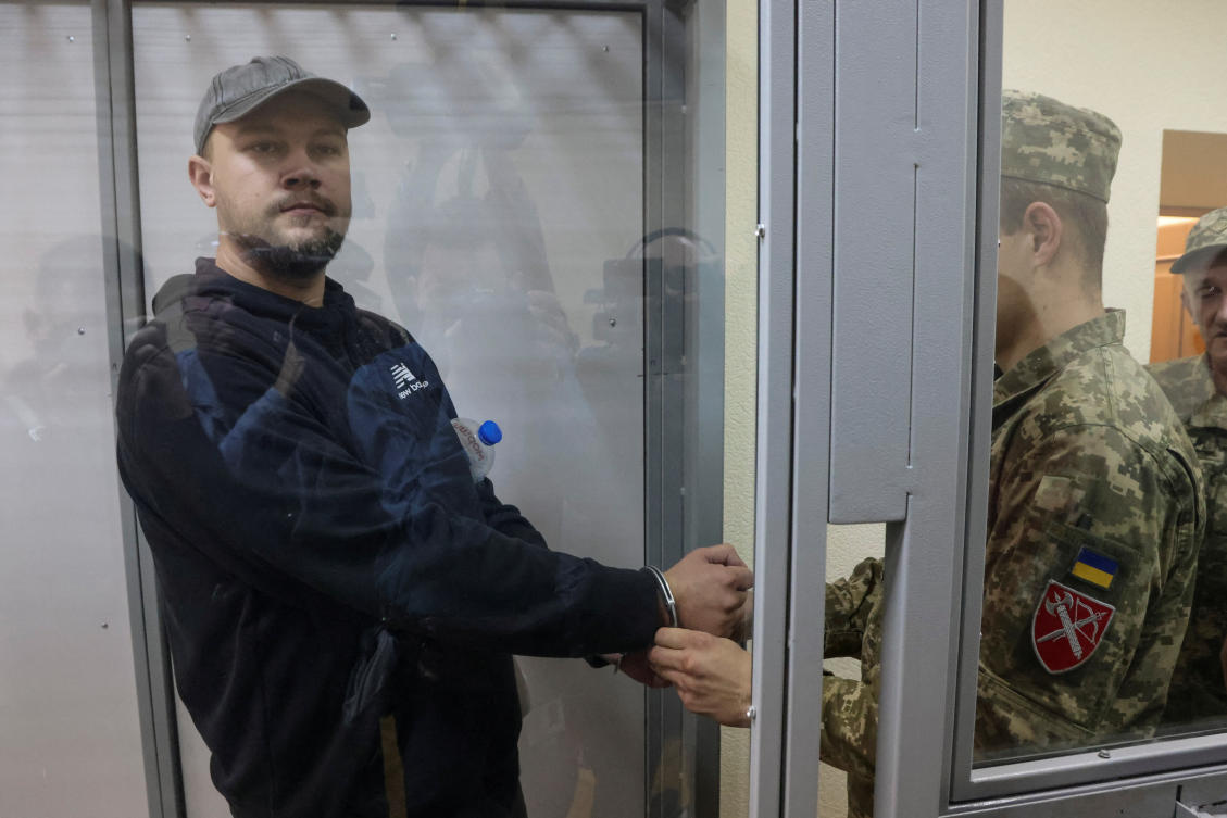 Ukrainian serviceman Serhii Hnezdilov, who quit the service without permission and publicly informed about it last month via Facebook, is seen inside an enclosure for defendants during a court hearing for choosing him as a preventive measure, in Kyiv on Oct. 11, 2024. (Reuters)