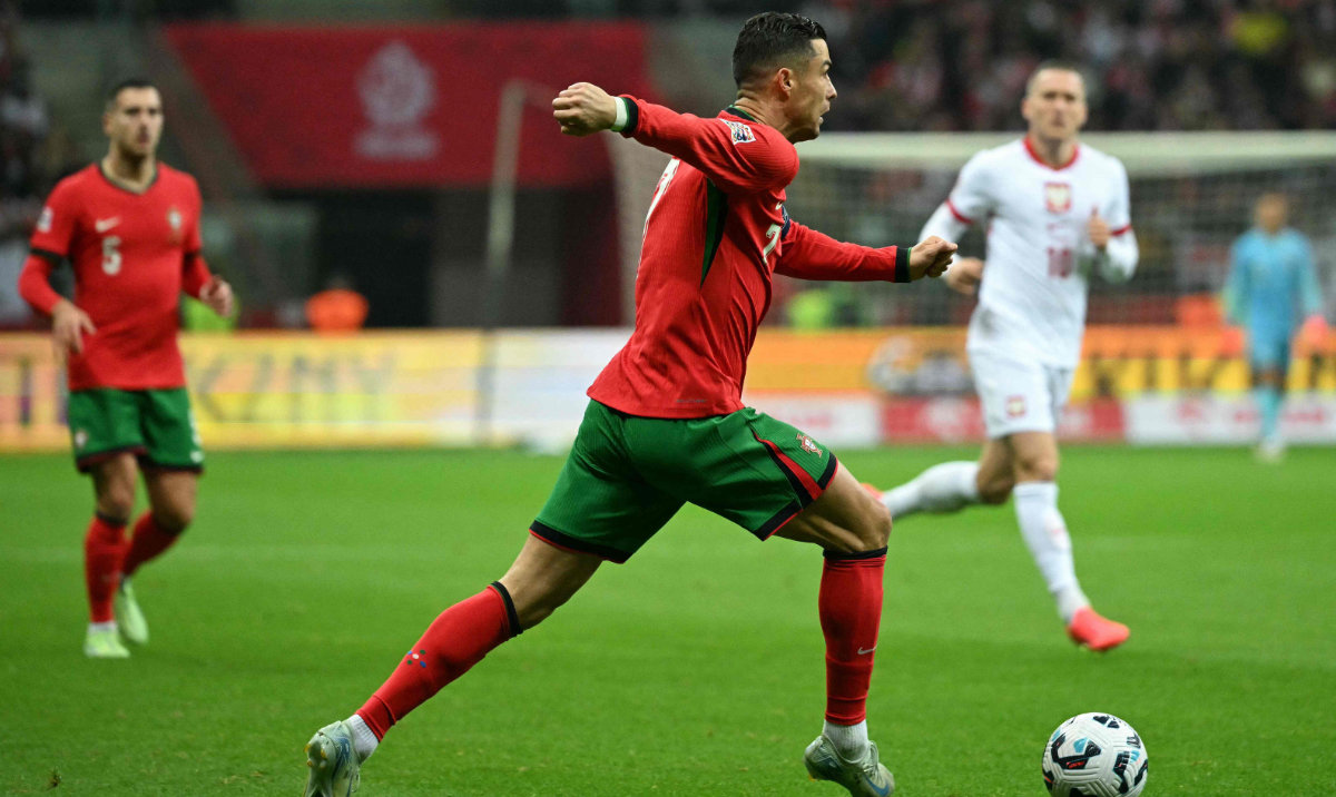 Portugal's forward #07 Cristiano Ronaldo runs with the ball during the UEFA Nations League, League A Group A1 football match Poland vs Portugal at the National Stadium in Warsaw, Poland on October 12, 2024. (AFP)