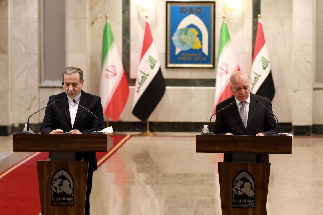 Iraqi Foreign Minister Fuad Hussein (R) attends a joint press conference with his Iranian counterpart Seyed Abbas Araghchi in Baghdad on Oct. 13. Iran’s top diplomat vowed upon his arrival in the Iraqi capital there would be “no red lines” for the country in defending its people and interests, ahead of Israel’s expected retaliation for Iran’s recent missile attack. (AFP)