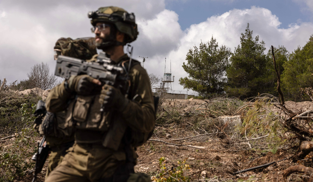 Israeli troops patrolling near a United Nations Interim Force In Lebanon (UNIFIL) base in the southern Lebanon's Naqoura region near the border. (AFP)