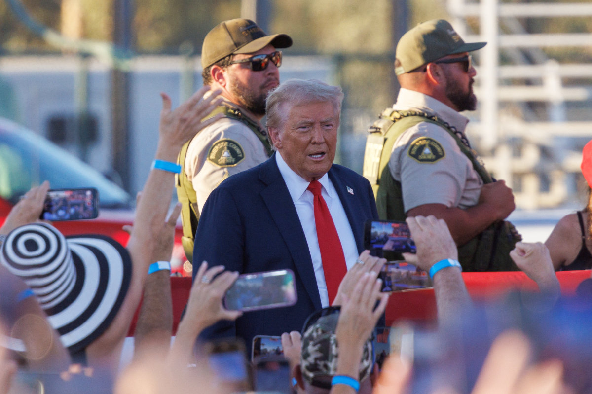 Riverside Country Sheriffs stand guard as Republican presidential nominee and former US President Donald Trump arrives at his rally in Coachella, California, on October 12, 2024. (REUTERS)