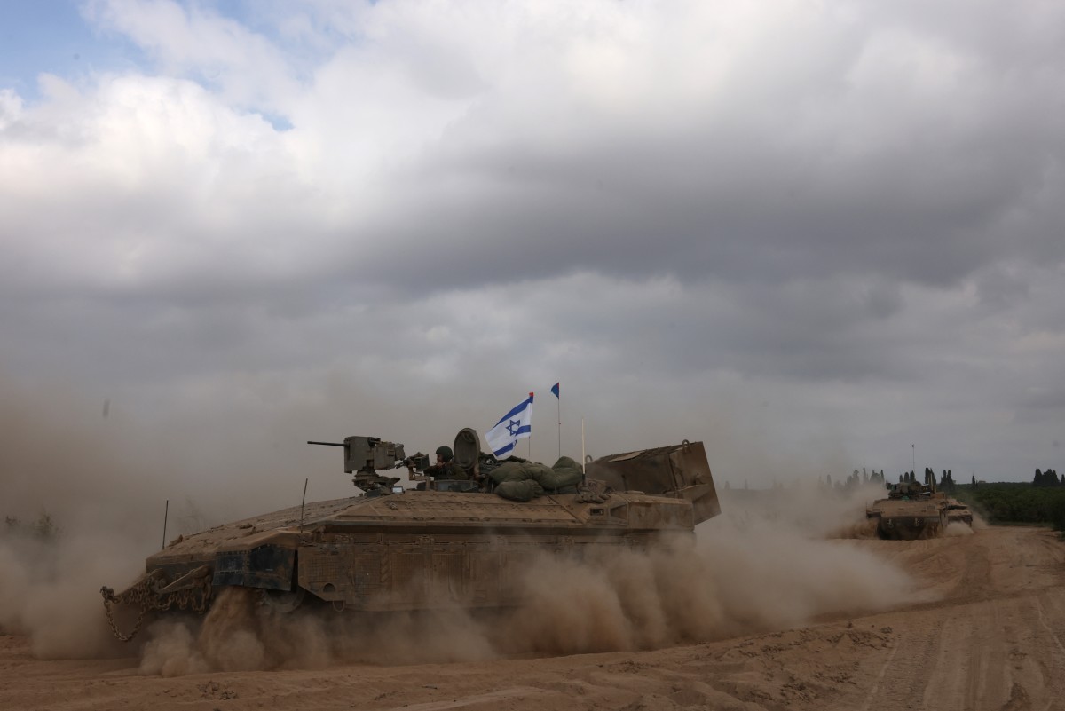 An Israeli army tank drives in an area near Israel's southern border with the Gaza Strip on October 6, 2024. (File/AFP)