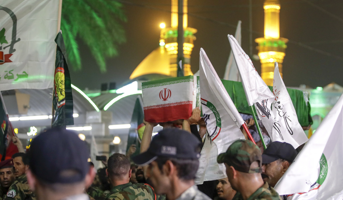 Mourners carry the coffin of Iranian Revolutionary Guards' deputy commander Brigadier Gen. Abbas Nilforushan who died alongside Hezbollah leader Hassan Nasrallah in an Israeli airstrike in Beirut last month during his funeral in Karbala, Iraq, Monday, Oct. 14, 2024. (AP)