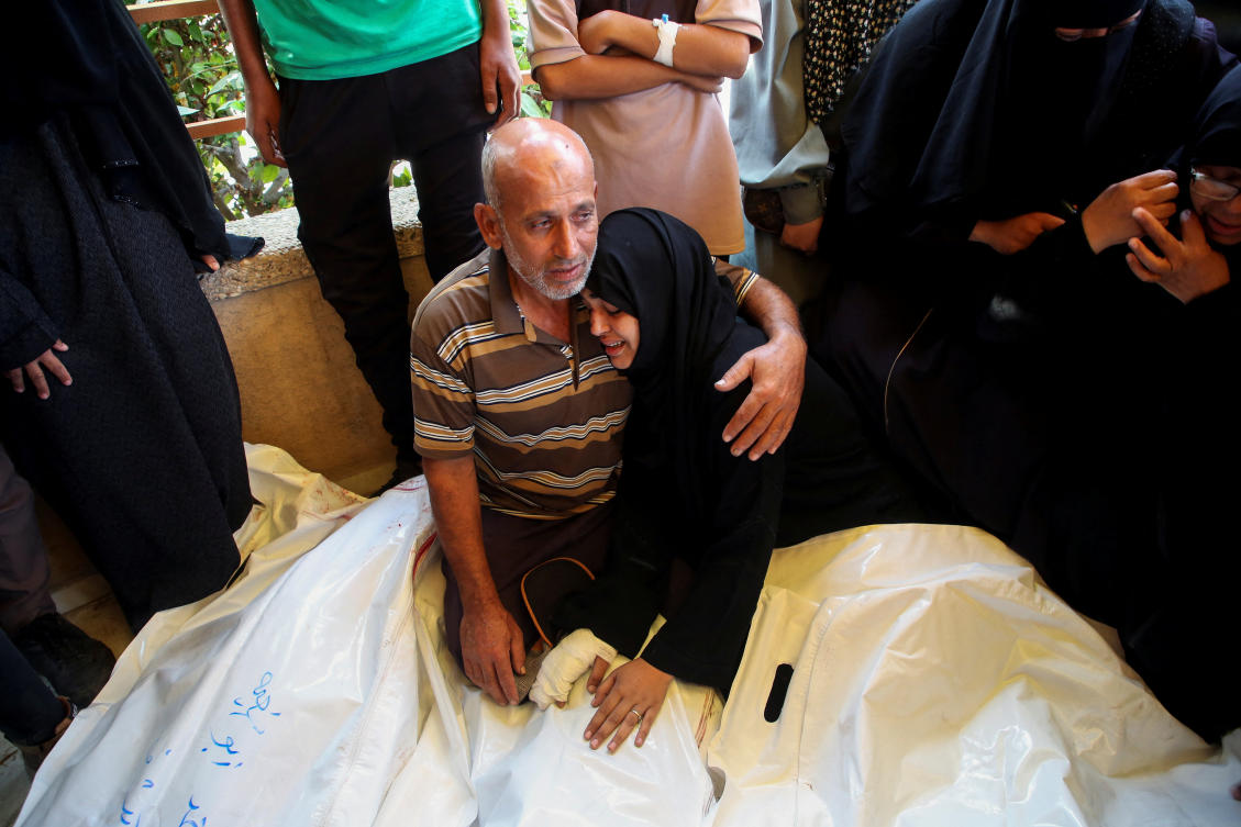 Relatives mourn next to the bodies of Palestinians from Abu Taima family, who were killed in an Israeli strike, amid the ongoing Israel-Hamas conflict, at Nasser hospital in Khan Younis. (Reuters)