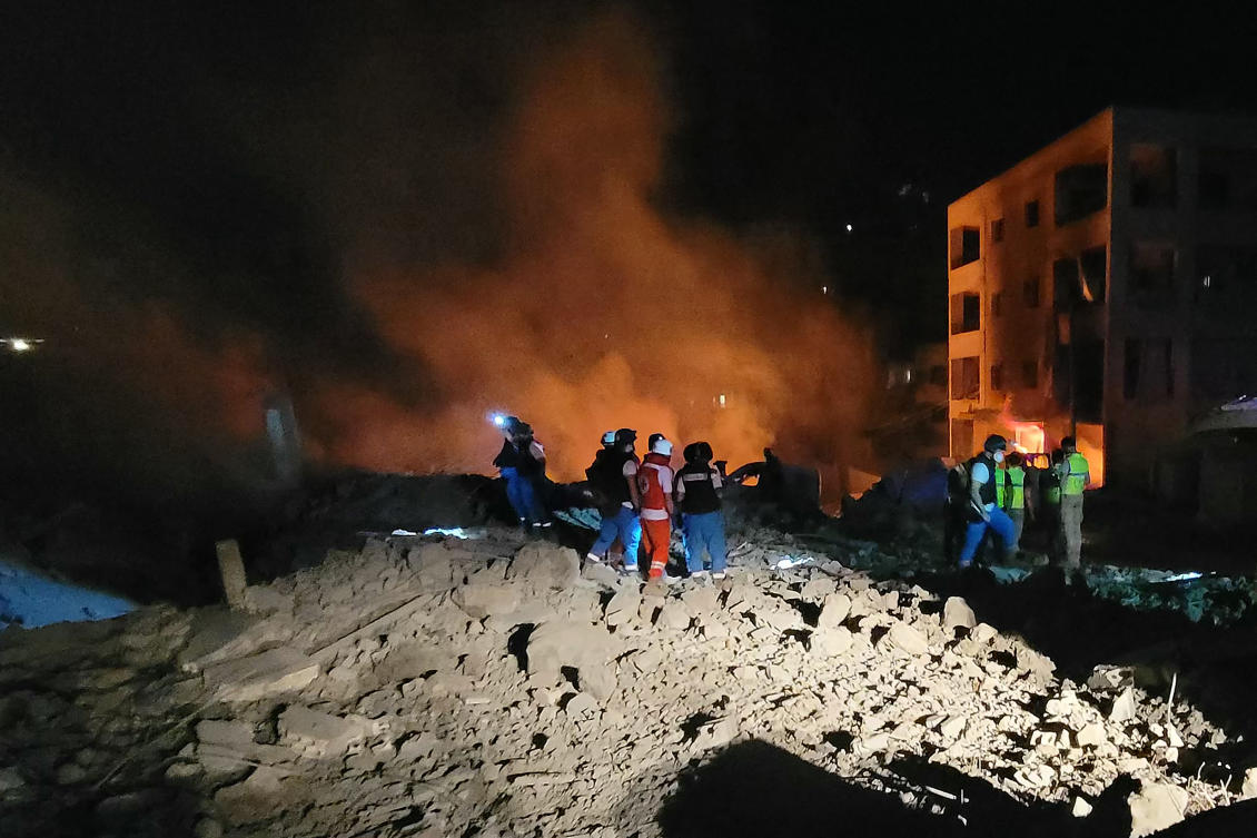 Rescuers and responders work at the site of an Israeli airstrike that targeted the southern Lebanese village of Toul on Oct. 15, 2024, amid the ongoing war between Israel and Hezbollah. (AFP)