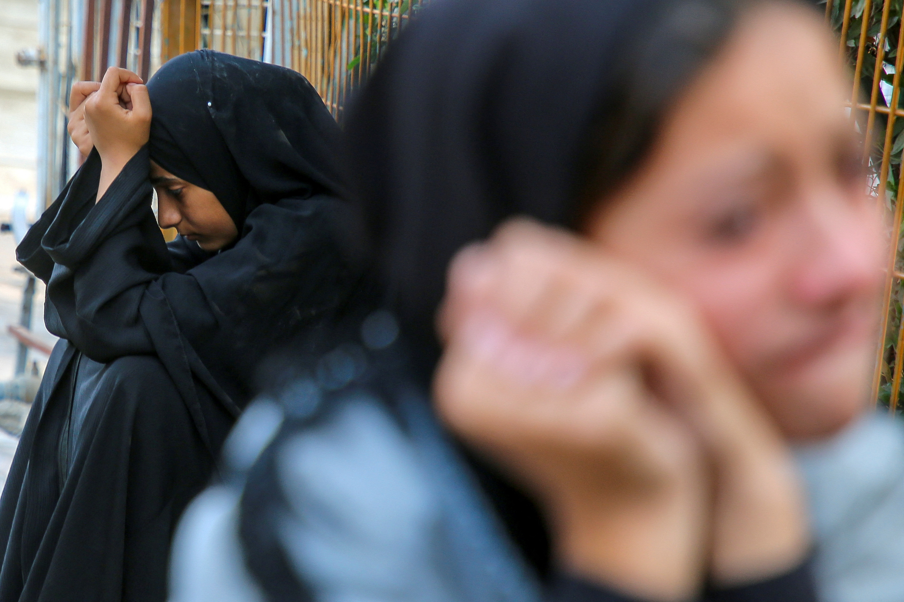 Relatives of Palestinians from Abu Taima family, who were killed in an Israeli strike, grieve during their funeral, amid the ongoing Israel-Hamas conflict, at Nasser hospital in Khan Younis, in the southern Gaza Strip, October 15, 2024. (REUTERS)