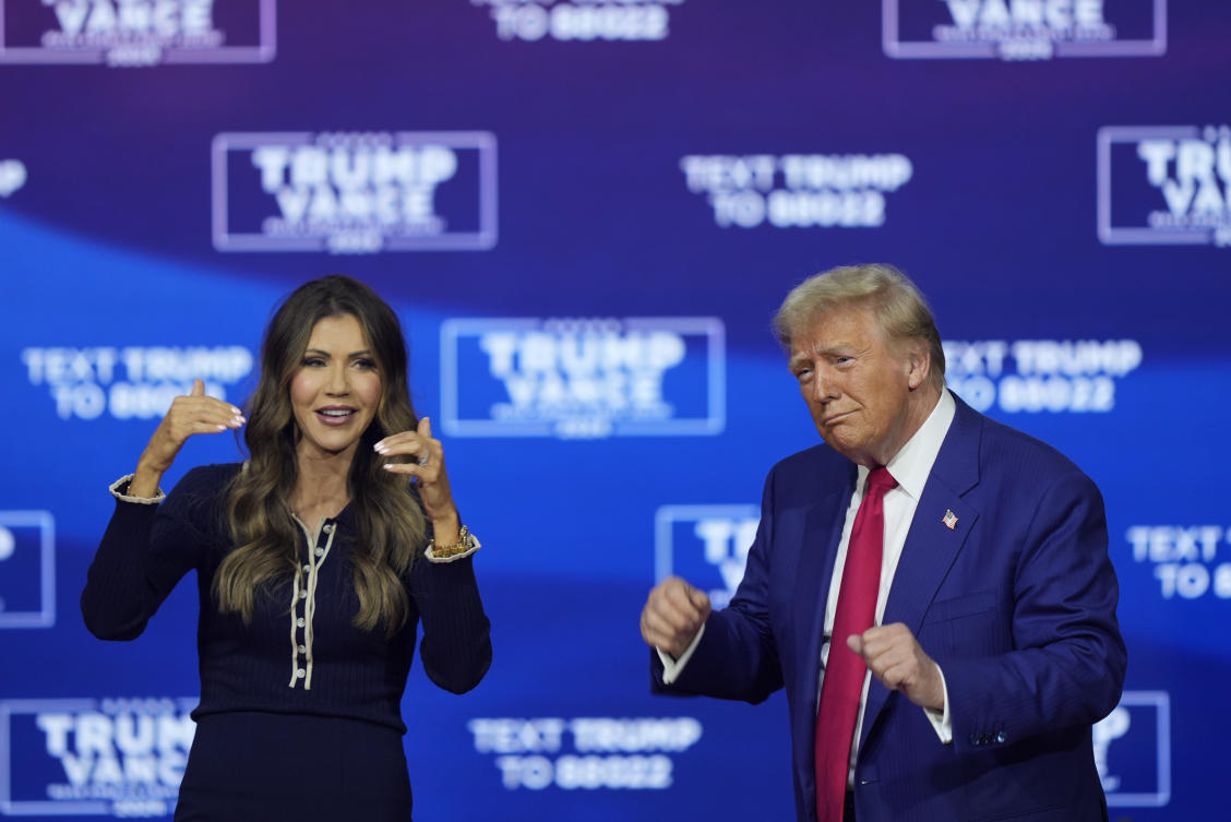 Republican presidential nominee former President Donald Trump and South Dakota Gov. Kristi Noem dance to the song "Y.M.C.A." at a campaign town hall at the Greater Philadelphia Expo Center & Fairgrounds. (AP)