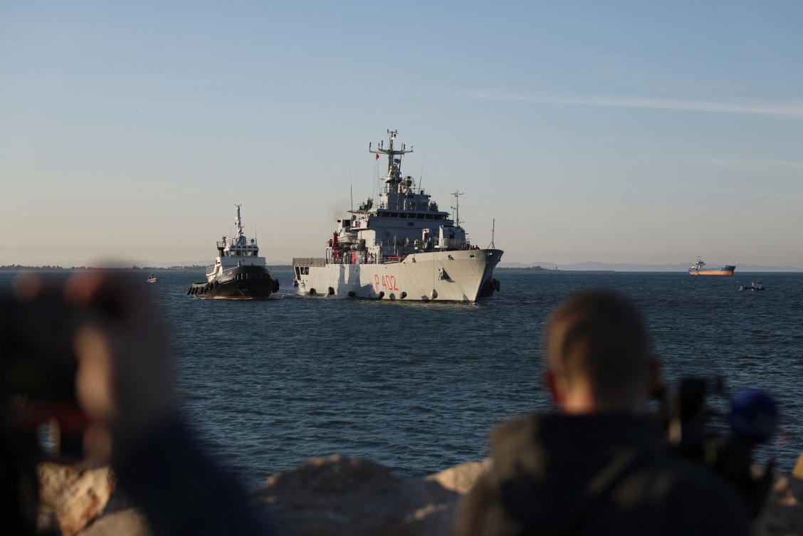 Italian navy ship Libra carrying migrants arrives in Albania as part of a deal with Italy to process thousands of asylum-seekers caught near Italian waters in Shengjin. (Reuters)