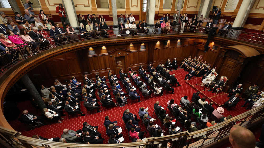 Above, legislators in the old legislative chamber in Wellington during the re-opening of parliament on Dec. 6, 2023. All 123 members of parliament voted for the change, in a rare show of political unity. (AFP)