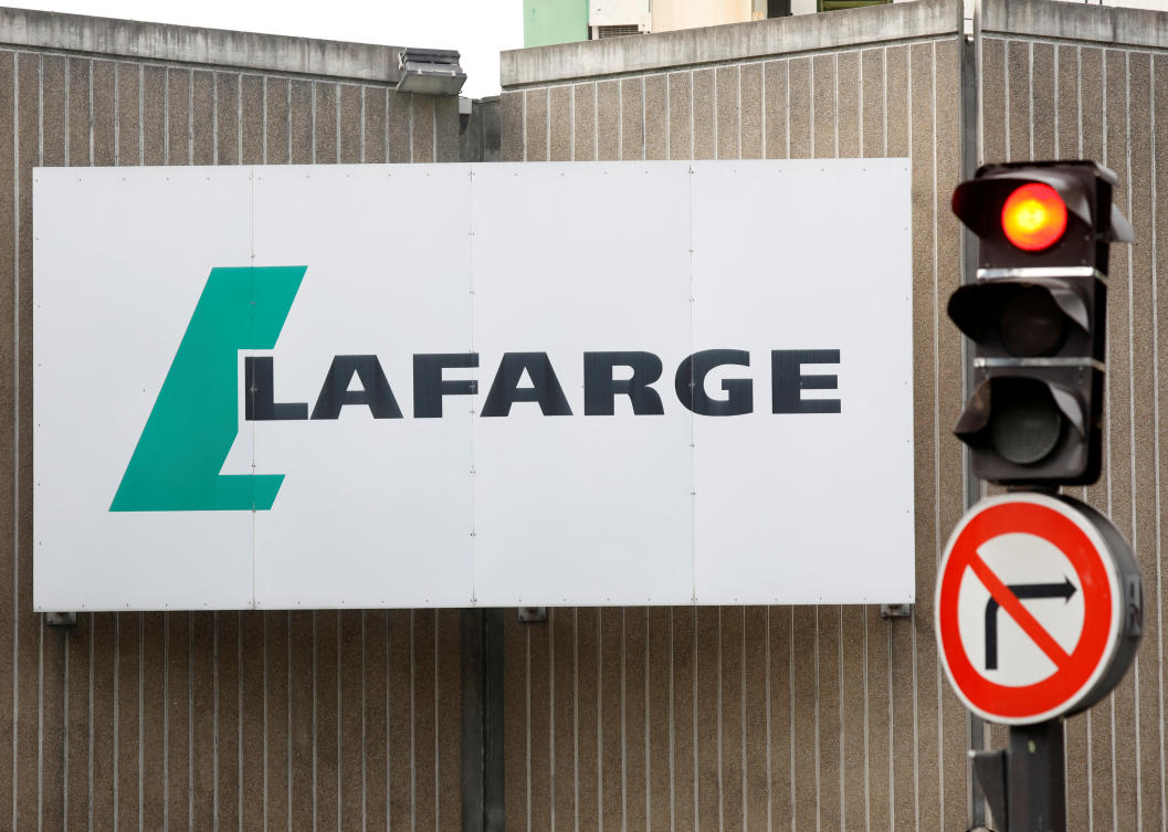 FILE PHOTO: The logo of French concrete maker Lafarge is seen on the plant of Bercy on the banks of the river Seine in Paris, France, September 3, 2020. REUTERS/Charles Platiau/File Photo