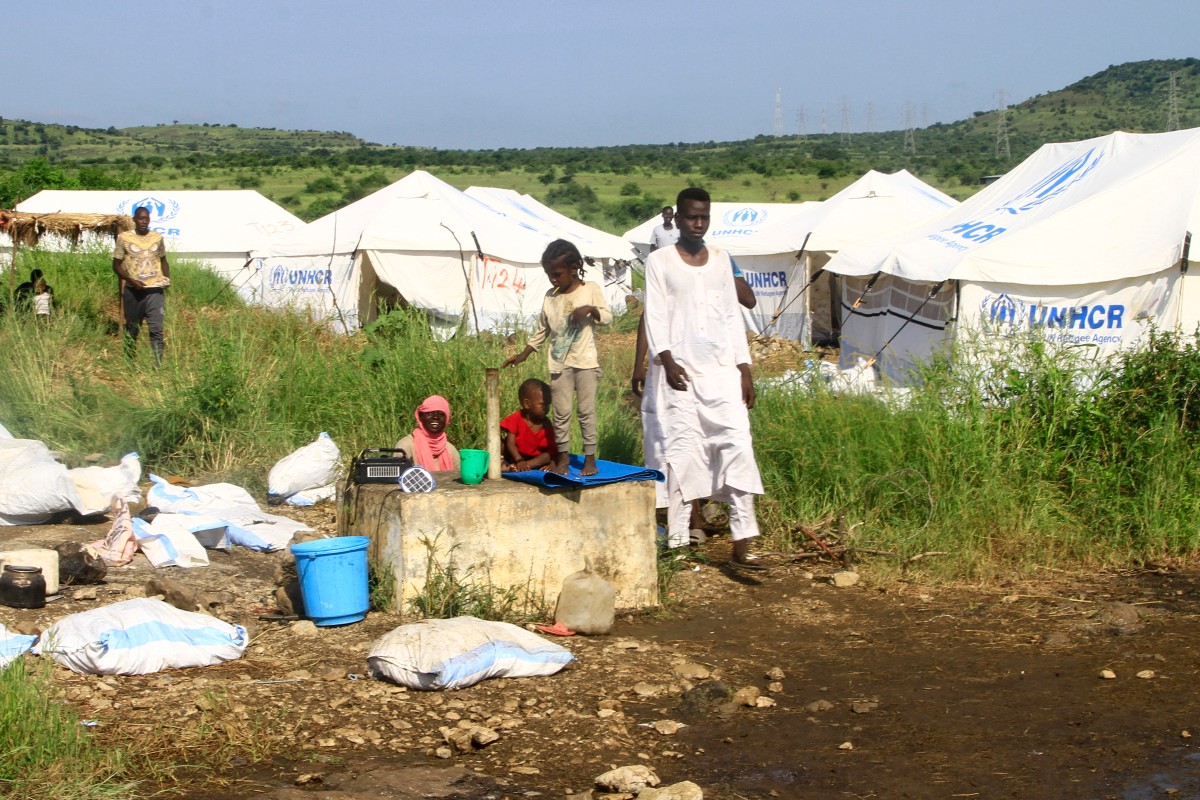 Displaced Sudanese who have returned from Ethiopia gather in a camp run by the United Nations Refugee Agency (UNHCR) in Sudan's border town of Gallabat in the eastern state of Gadaref on September 11, 2024 (AFP)