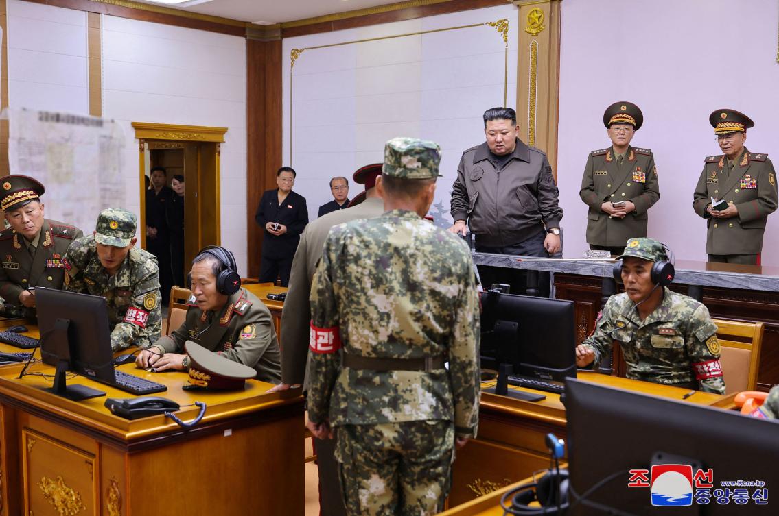 Kim Jong Un, center, visits the command of the 2nd Corps of the Korean People’s Army at an undisclosed location in North Korea. (KCNA/KNS via AFP)