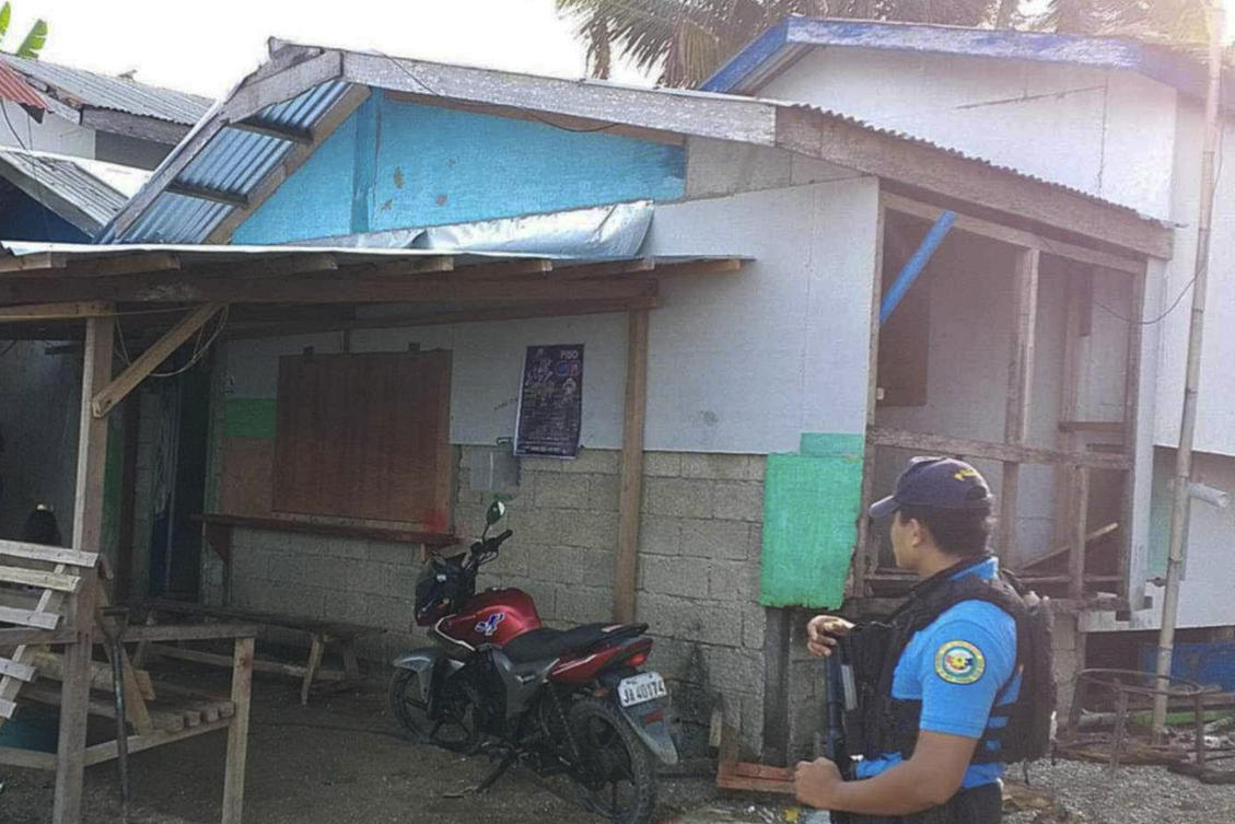 A policeman checks an area Friday Oct. 18, 2024 where an American identified as Elliot Onil Eastman was reportedly abducted by gunmen in Sibuco town, Zamboanga del Norte in southern Philippines. (Philippine National Police Regional Office 9 via AP)
