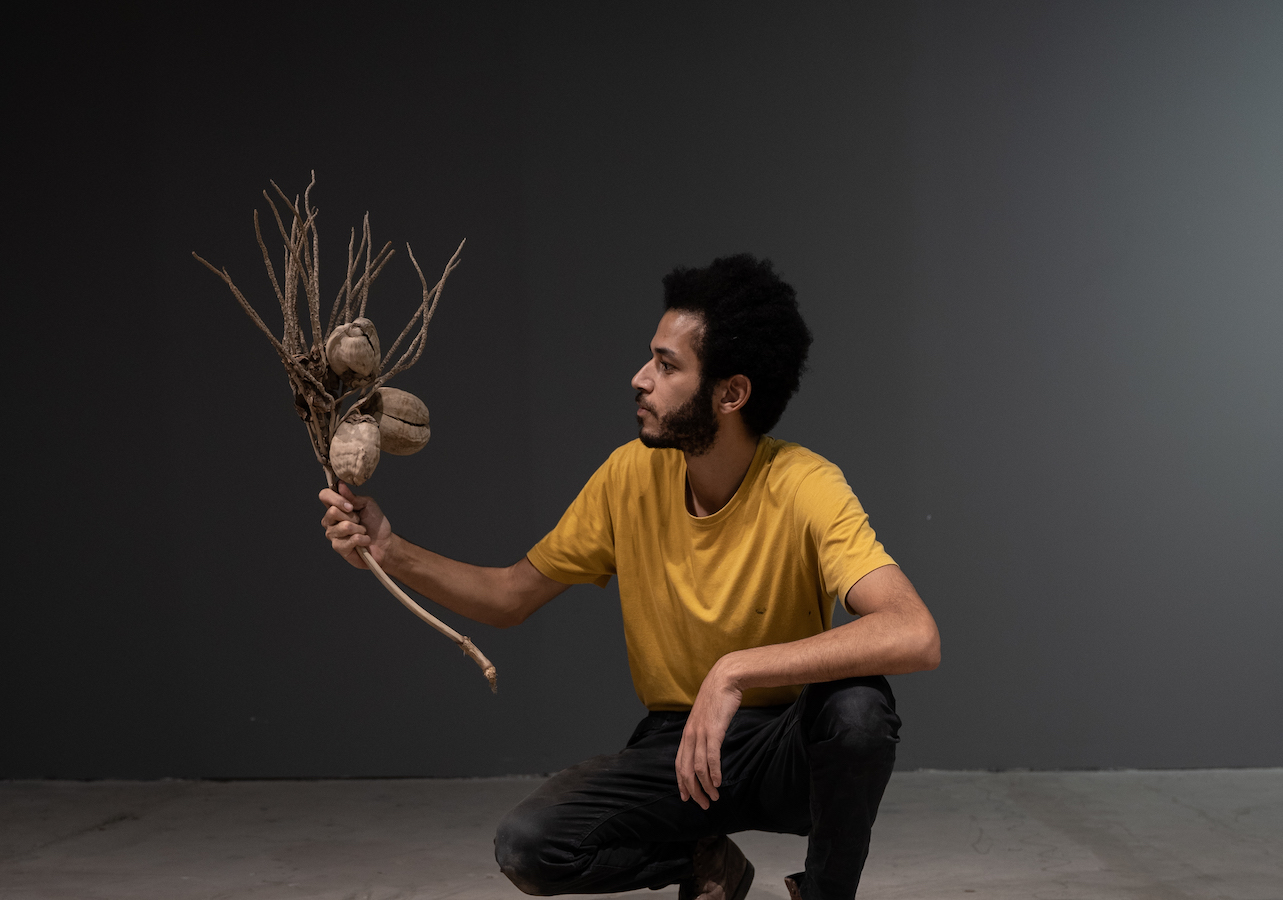 Mohammed AlFaraj with his work 'From What Bone Will We Grow Back On the First Day of Eternity.' (Supplied)