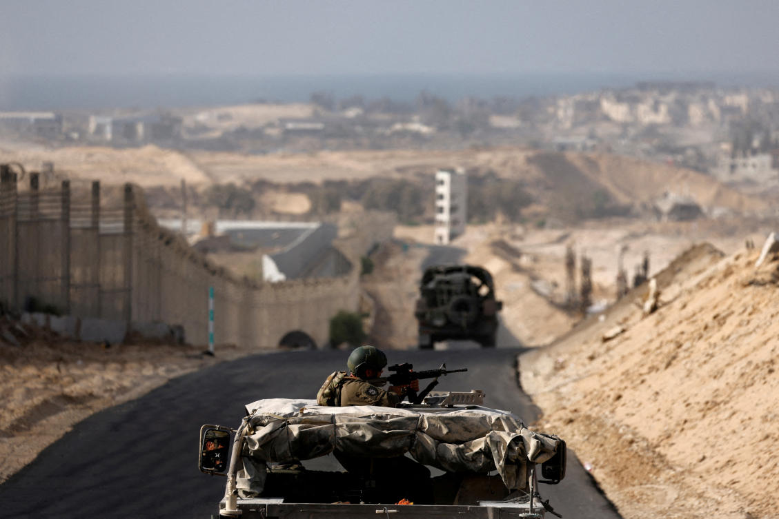 Israeli military vehicles drive through the so-called Philadelphi corridor in southern Gaza, amid the ongoing conflict between Israel and Hamas in the Gaza Strip, Sept. 13, 2024. (Reuters/File)