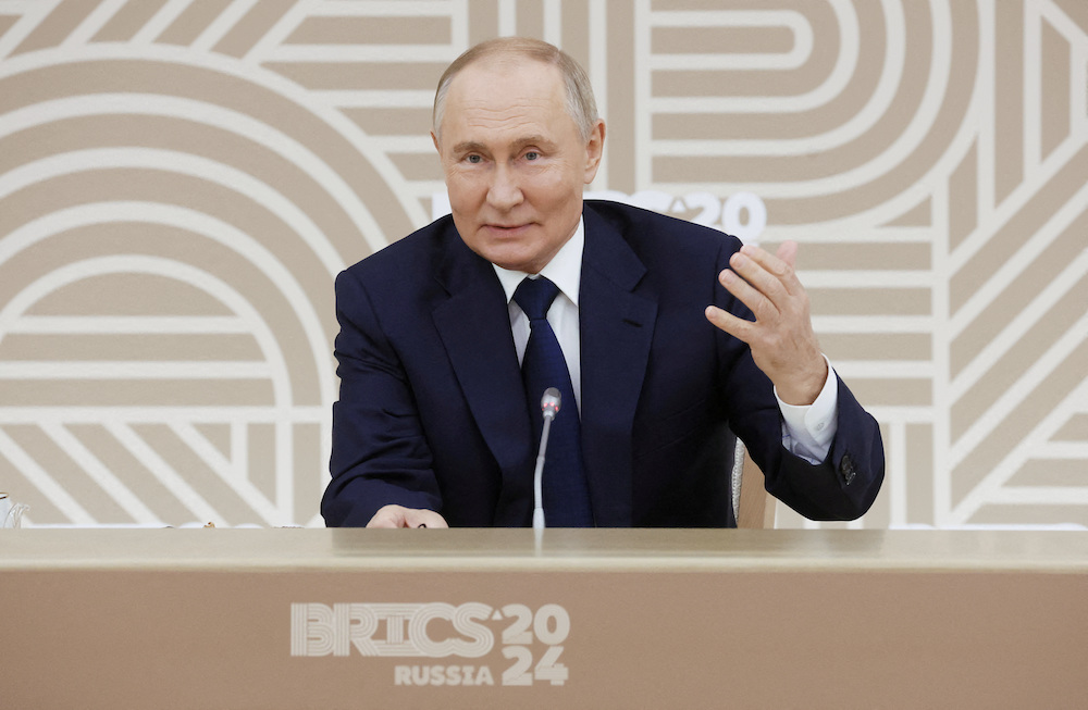 Russian President Vladimir Putin attends a meeting with heads of leading media outlets from the BRICS member countries in Moscow Region, Russia October 18, 2024. (Sputnik/Pool via Reuters)
