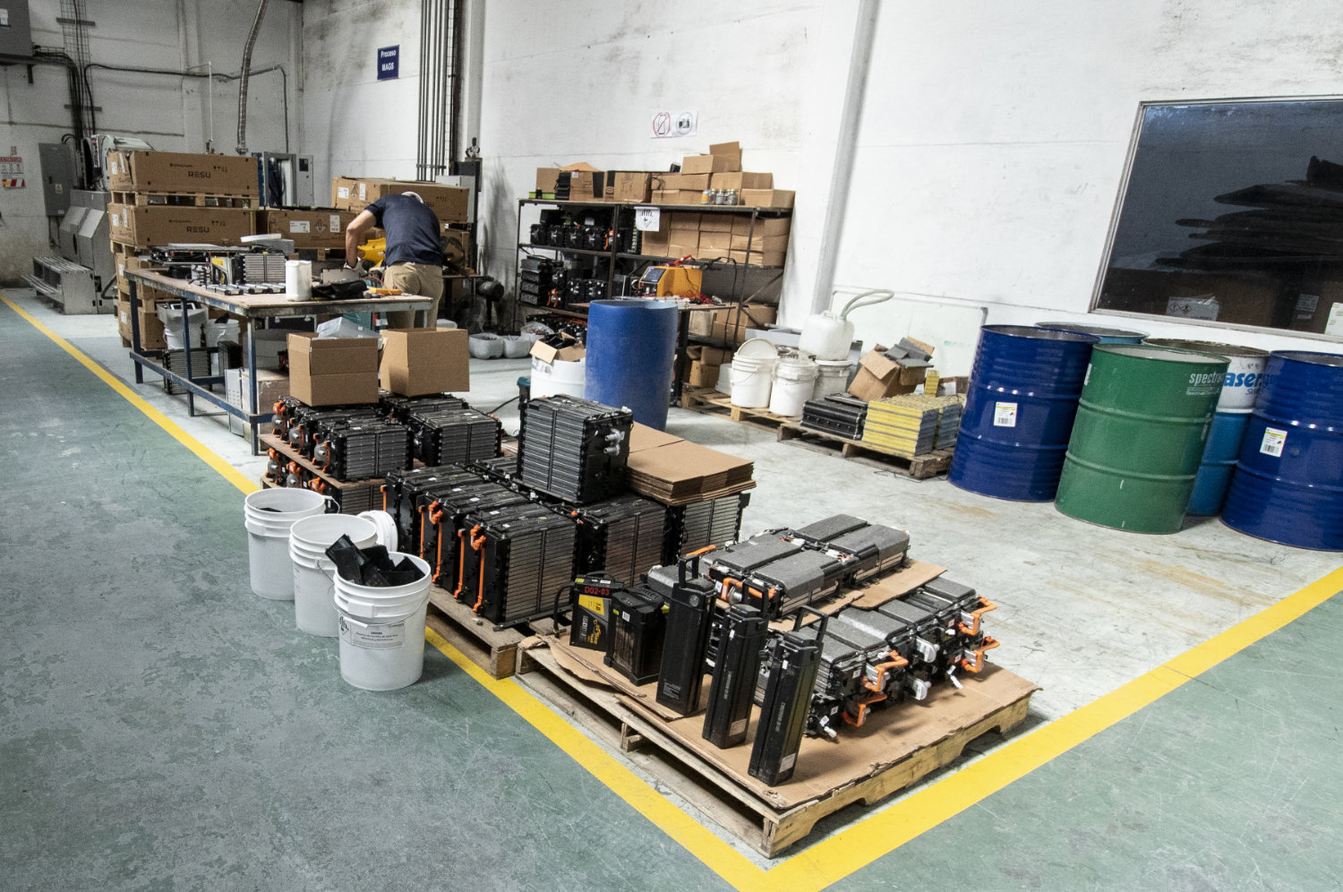 Staff from the Fortech company in Cartago, Costa Rica, disassembles batteries from electric cars to recycle them. Fortech recycles lithium batteries from telephones, computers, electric cars and other items to sell the resulting materials for the construction of new batteries. (AFP)