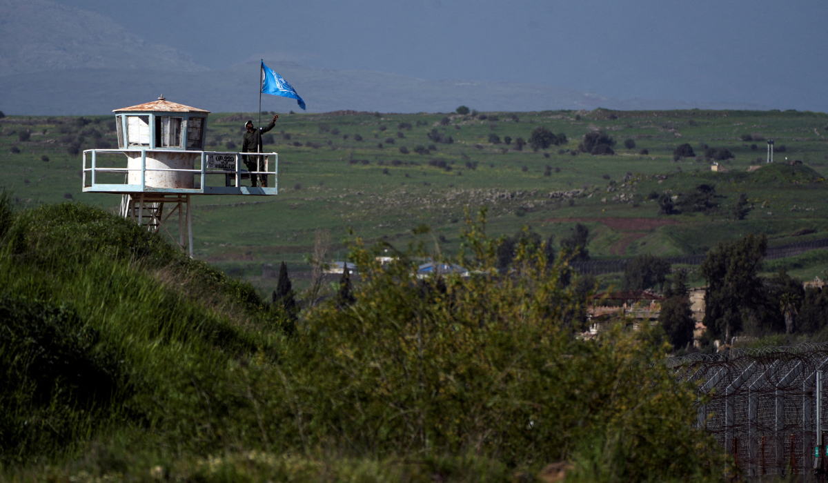 A UN peacekeeper guards at a post along the Israel-Syria border in the Israeli-occupied Golan Heights, April 2, 2024. (REUTERS)