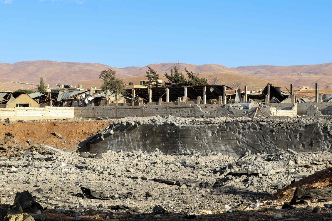 People inspect an area that was hit by an Israeli air strike on the village of Taybeh in Lebanon's eastern Bekaa Valley on October 18, 2024. (AFP)